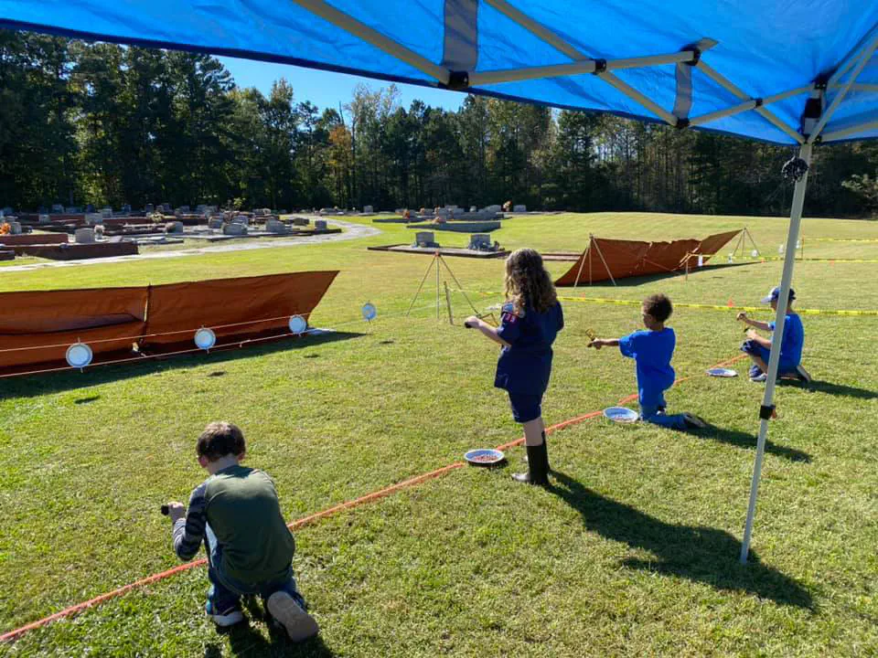 Cub Scouts shooting sling shots